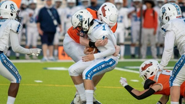football players on field during daytime