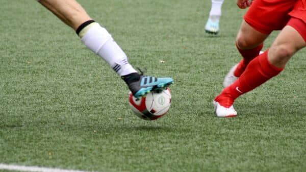 a couple of men playing a game of soccer