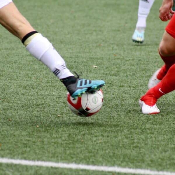 a couple of men playing a game of soccer