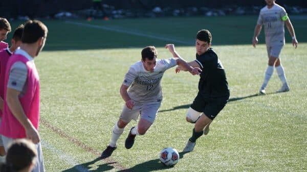 man playing soccer on the field