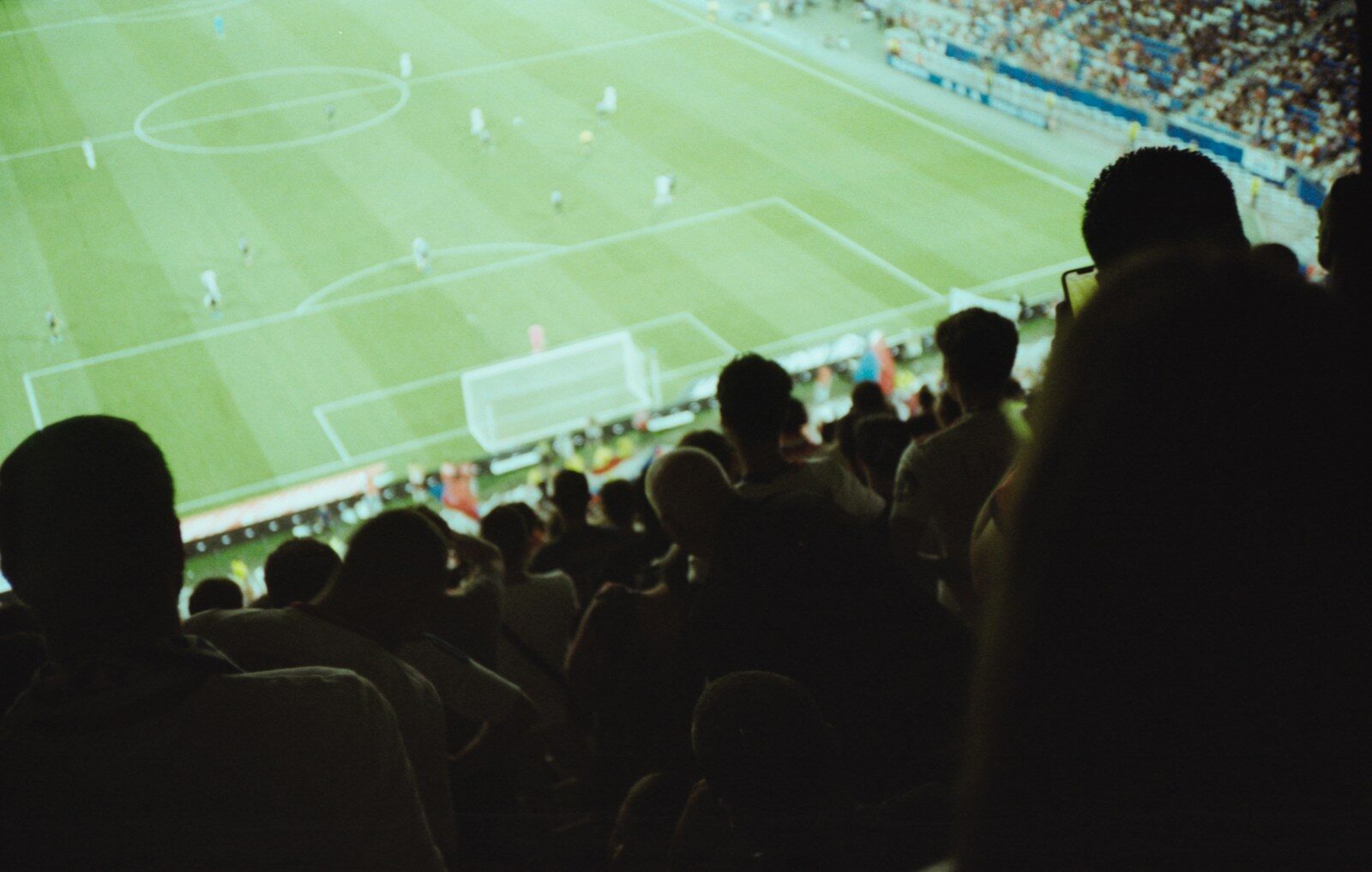 a crowd of people watching a soccer game