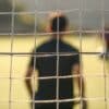 man standing near the goal post