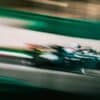 a blurry photo of a racing car driving down a track