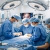 Surgeons performing surgery in a modern operating room