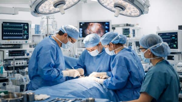 Surgeons performing surgery in a modern operating room